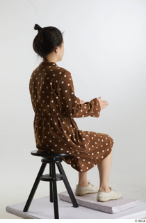 Aera  1 brown dots dress casual dressed sitting white…